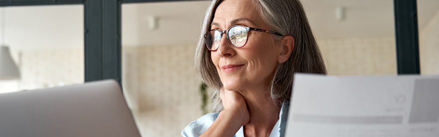 Register Your Business woman looking at paper